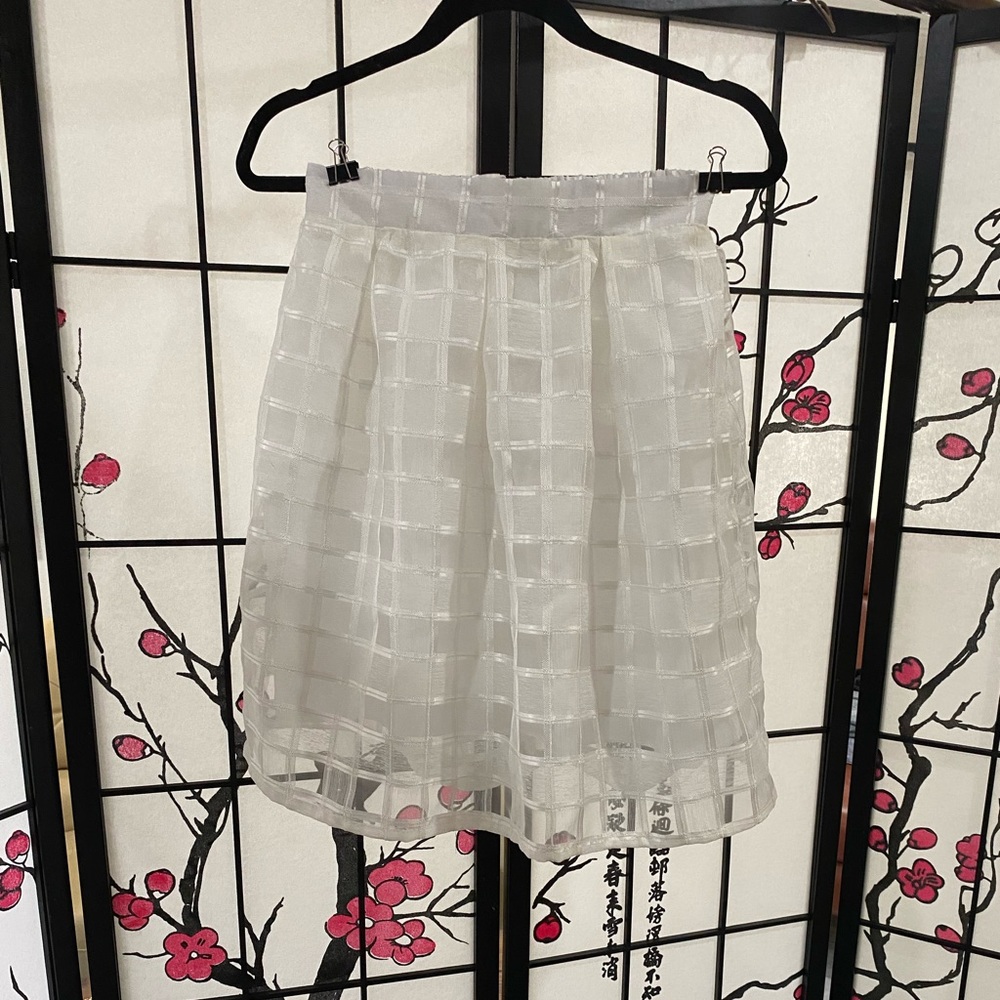 Sweet little white skirt. Perfect for the holidays